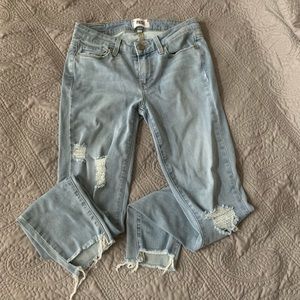 Boutique distressed unfinished hem skinny jeans